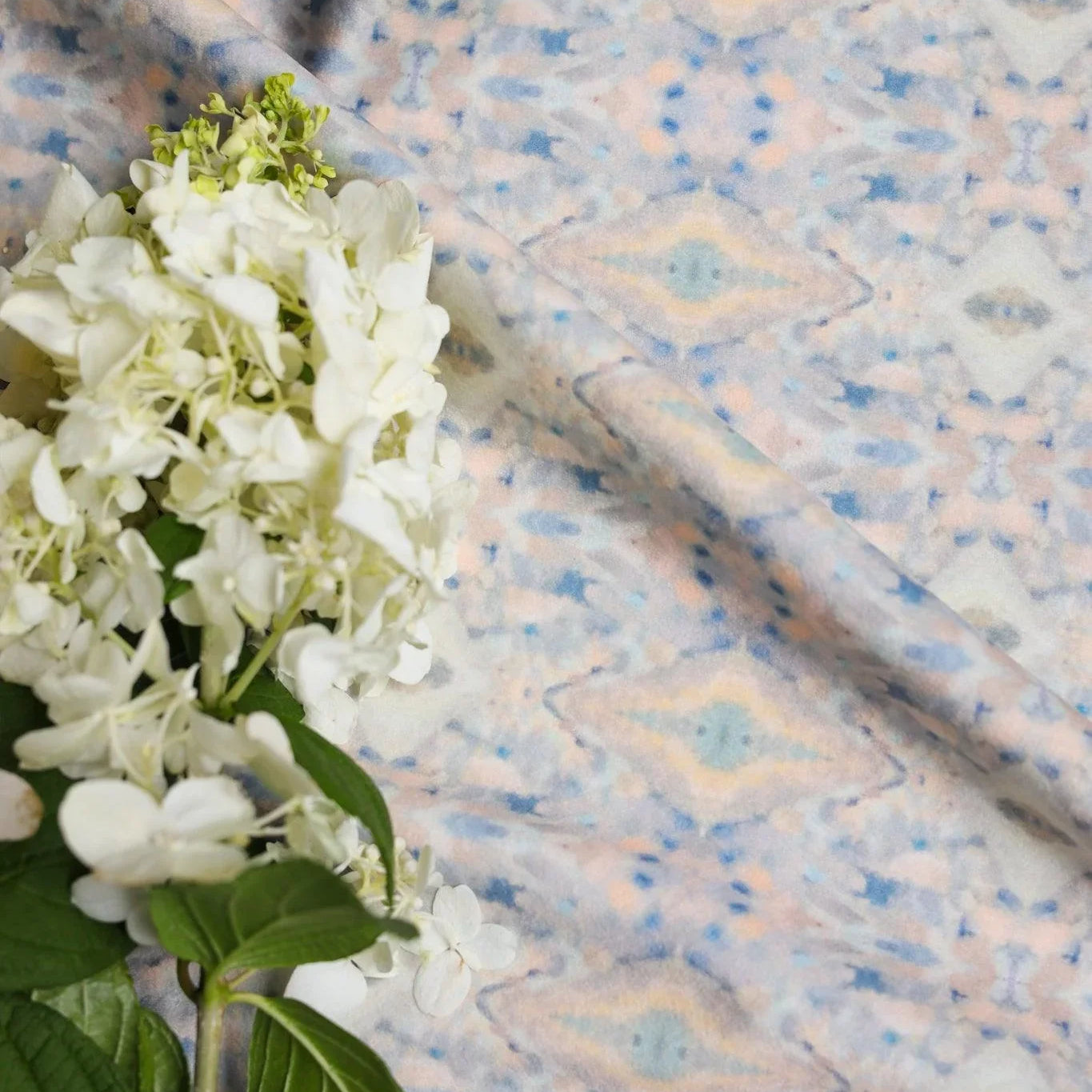 Luxury abstract fabric with layered organic movement inspired by Colorado River rock, designed for upholstery, drapery, bedding, and modern traditional interiors. Small-scale repeat with soft tonal variation and natural texture for collected luxury homes. Sustainably printed and handcrafted in England by Truett