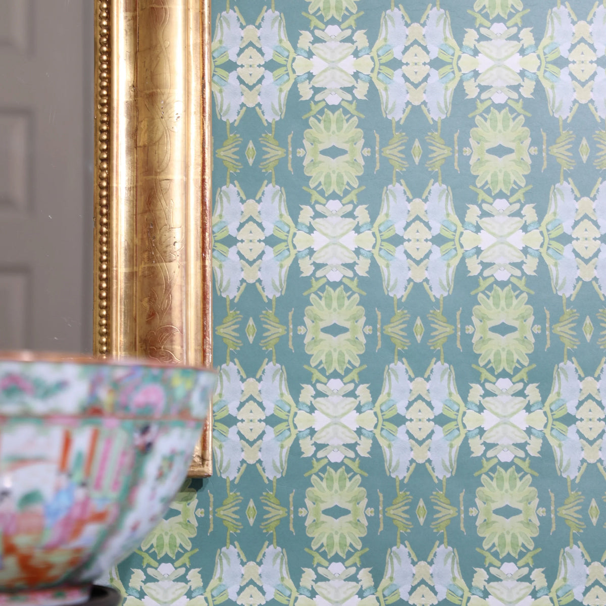 Luxury abstract floral wallpaper in rich dark green tones with layered organic movement, designed for modern traditional and collected interiors.