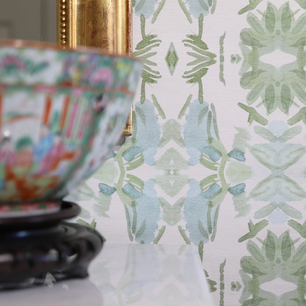 Luxury botanical wallpaper featuring an artistic wildflower-inspired pattern in sage green and soft blue, designed for modern traditional interiors, powder rooms, bedrooms, dining rooms, and collected homes.