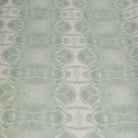 Luxury abstract botanical fabric featuring layered tree-inspired movement in calming jade green and soft neutral tones for collected modern traditional interiors.